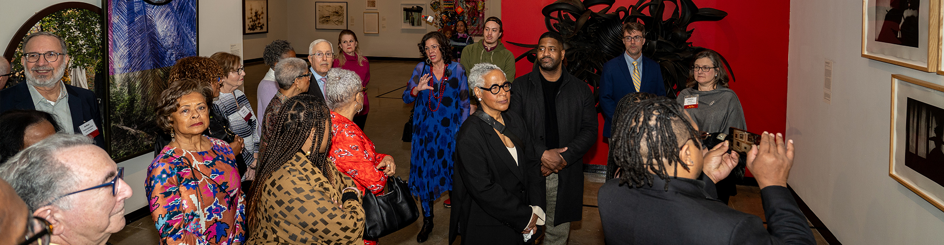 Visitors walking around Weston Gallery during the exhibition "Century: 100 Years of Black Art at MAM"